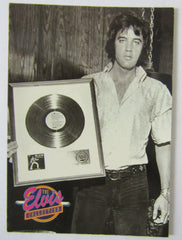 Elvis Presley with RIAA award