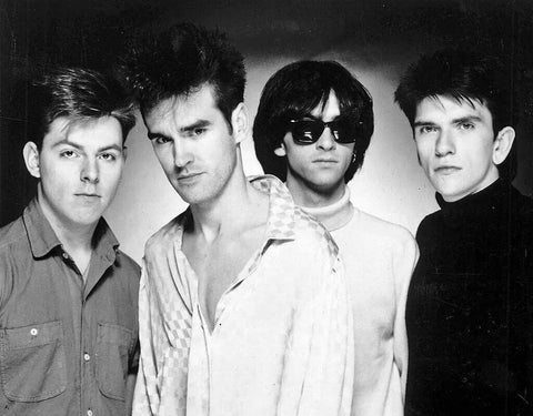 Andy Rourke with The Smiths in 1985